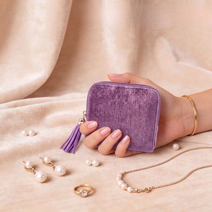 Perly jewelry case held in one hand beside necklaces and rings